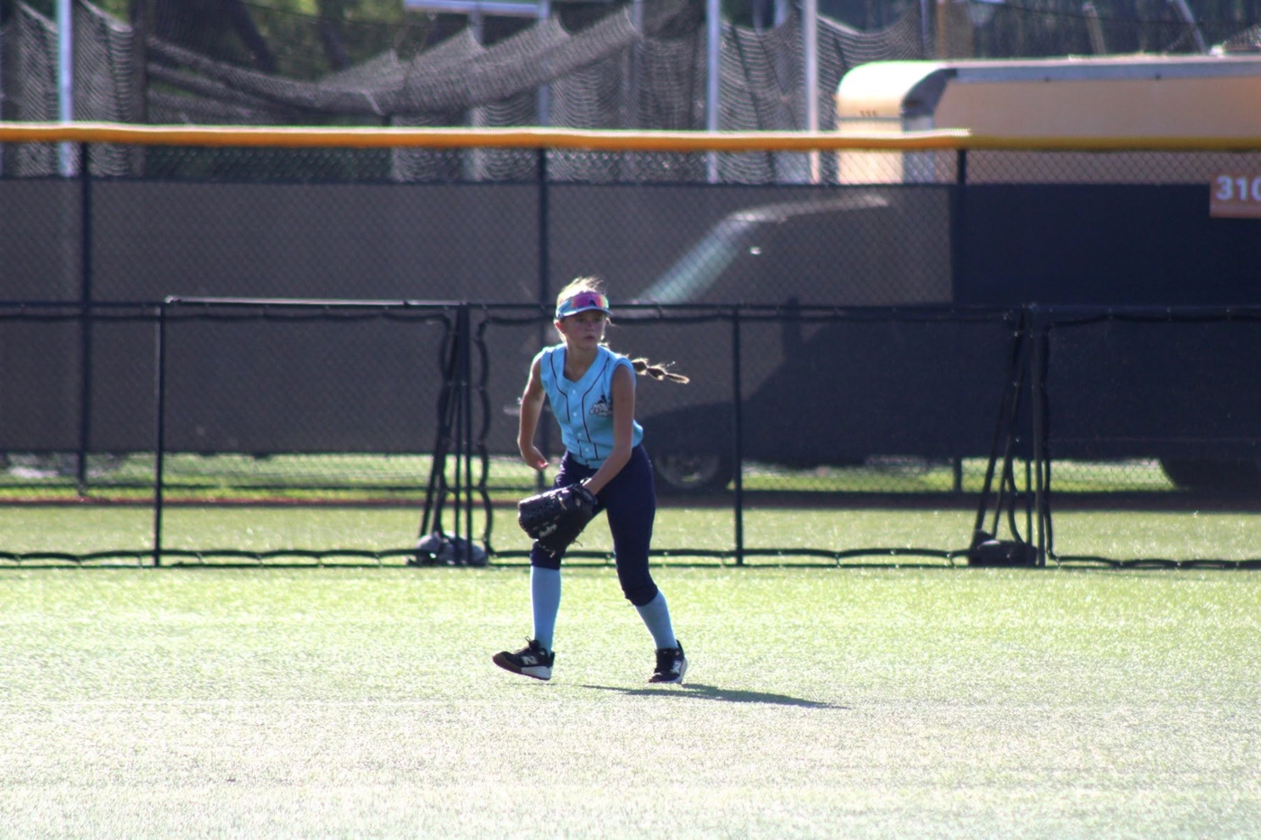 Addilynn Goins playing softball