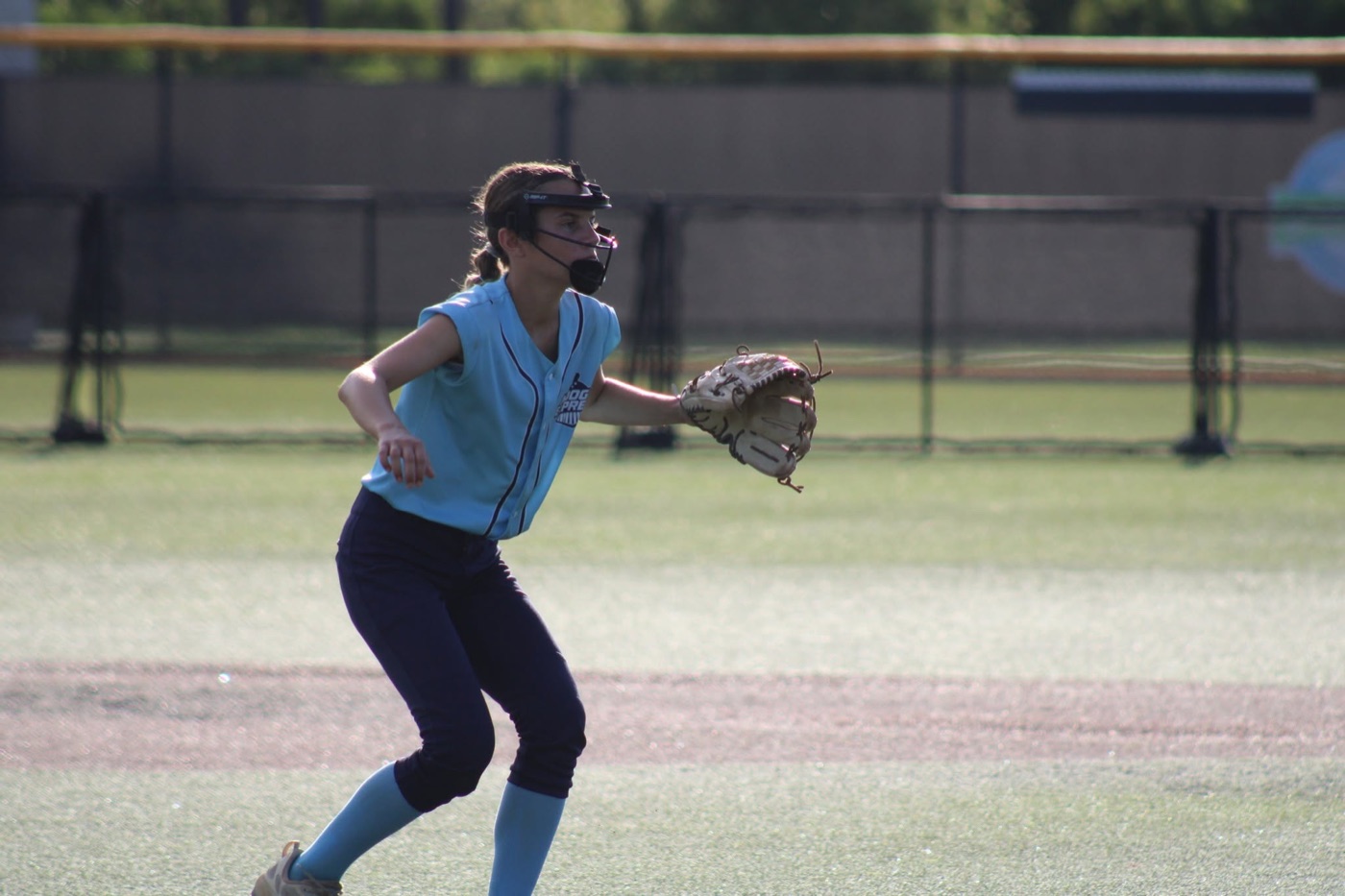 Vera Sanders playing softball
